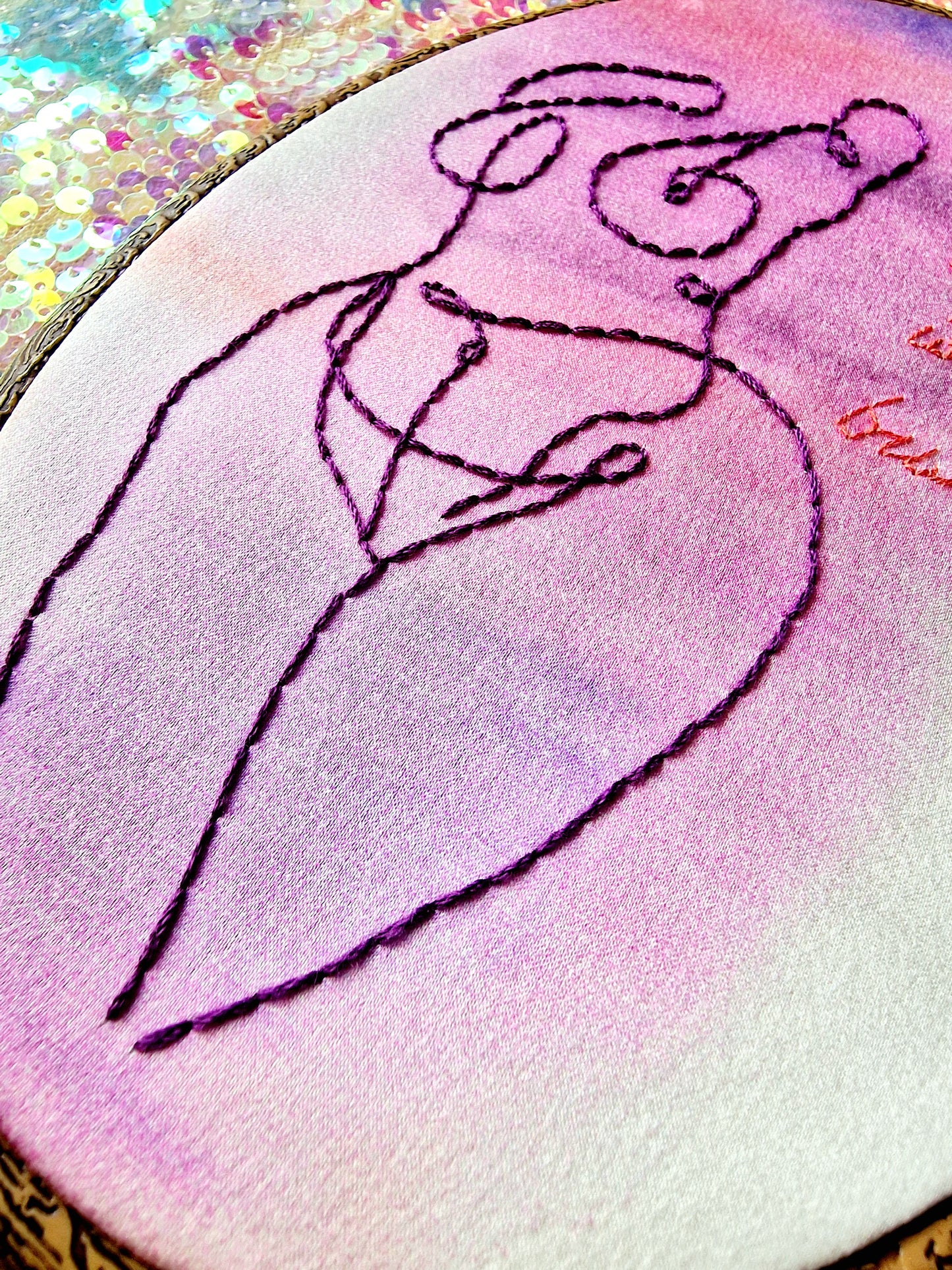 Close-up of hand embroidery on watercolour silk - My Body My Business feminist hoop art by Finn & Pea