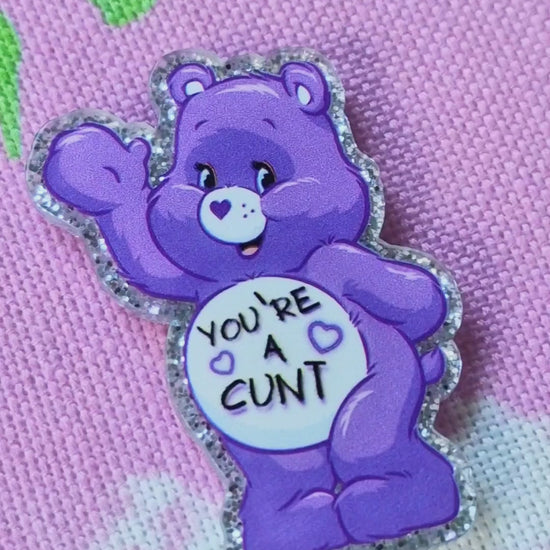 Close-up of swear bear design on purple needle minder - Strong magnet embroidery tool