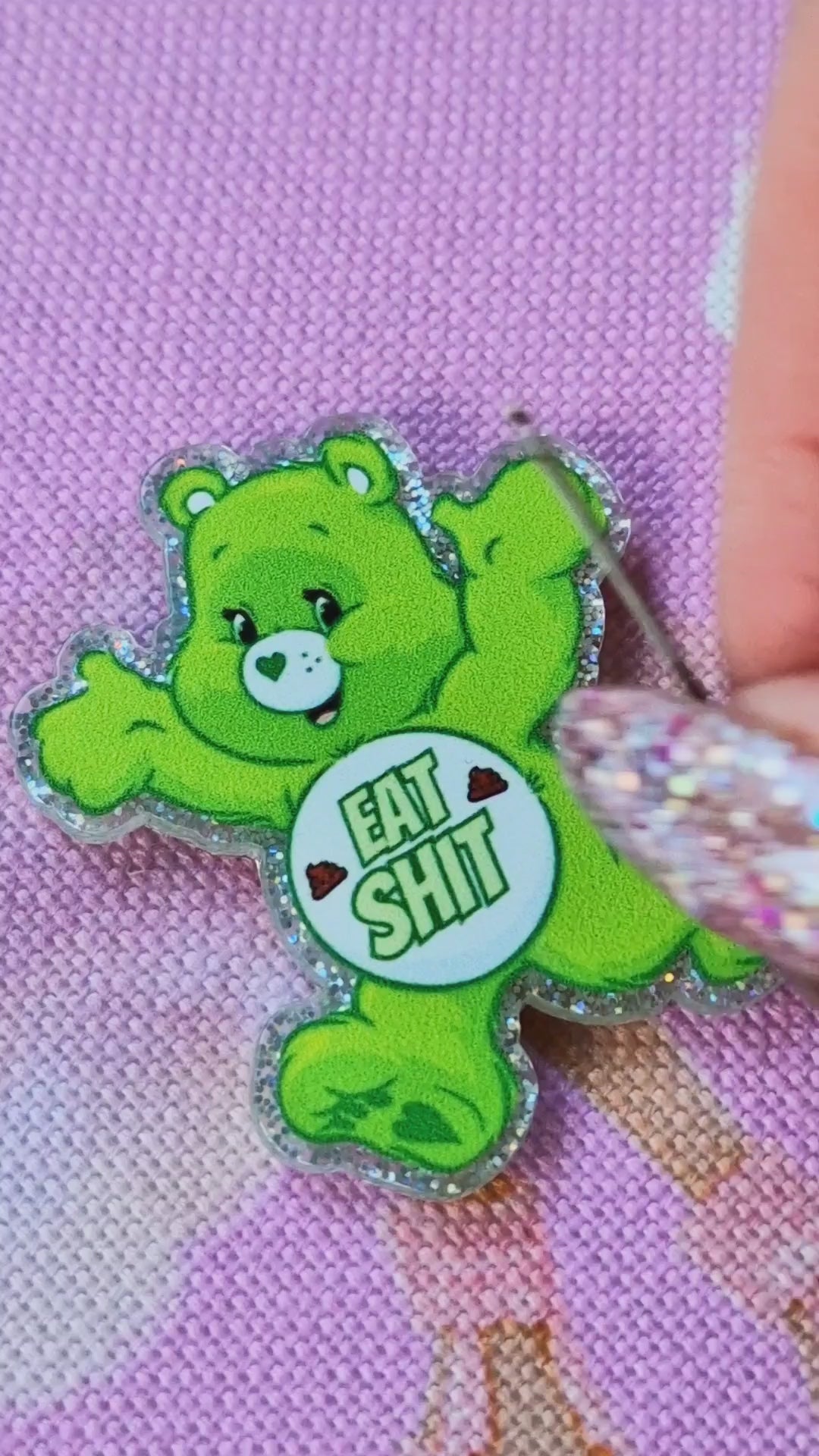Close-up of swear bear design on green needle minder - Strong magnet embroidery tool